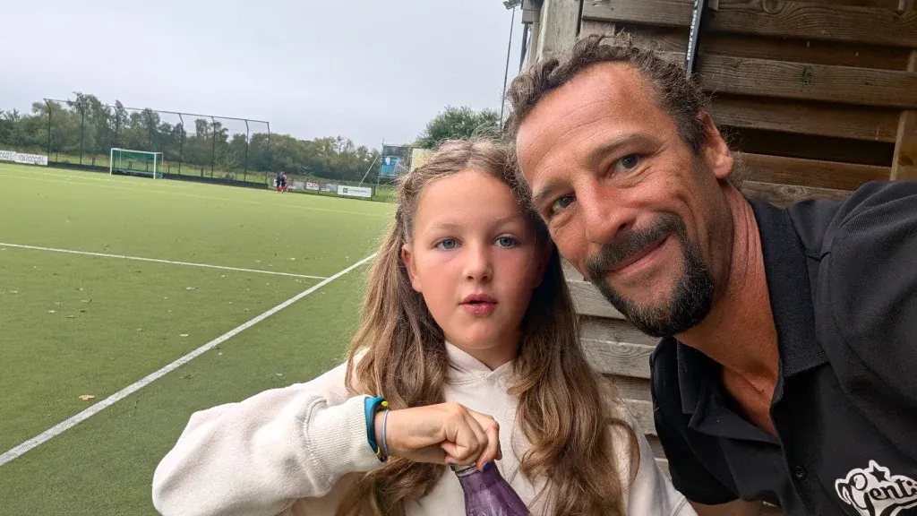 Manon and Jerome in the pre-game dugout supporting pitchside with love